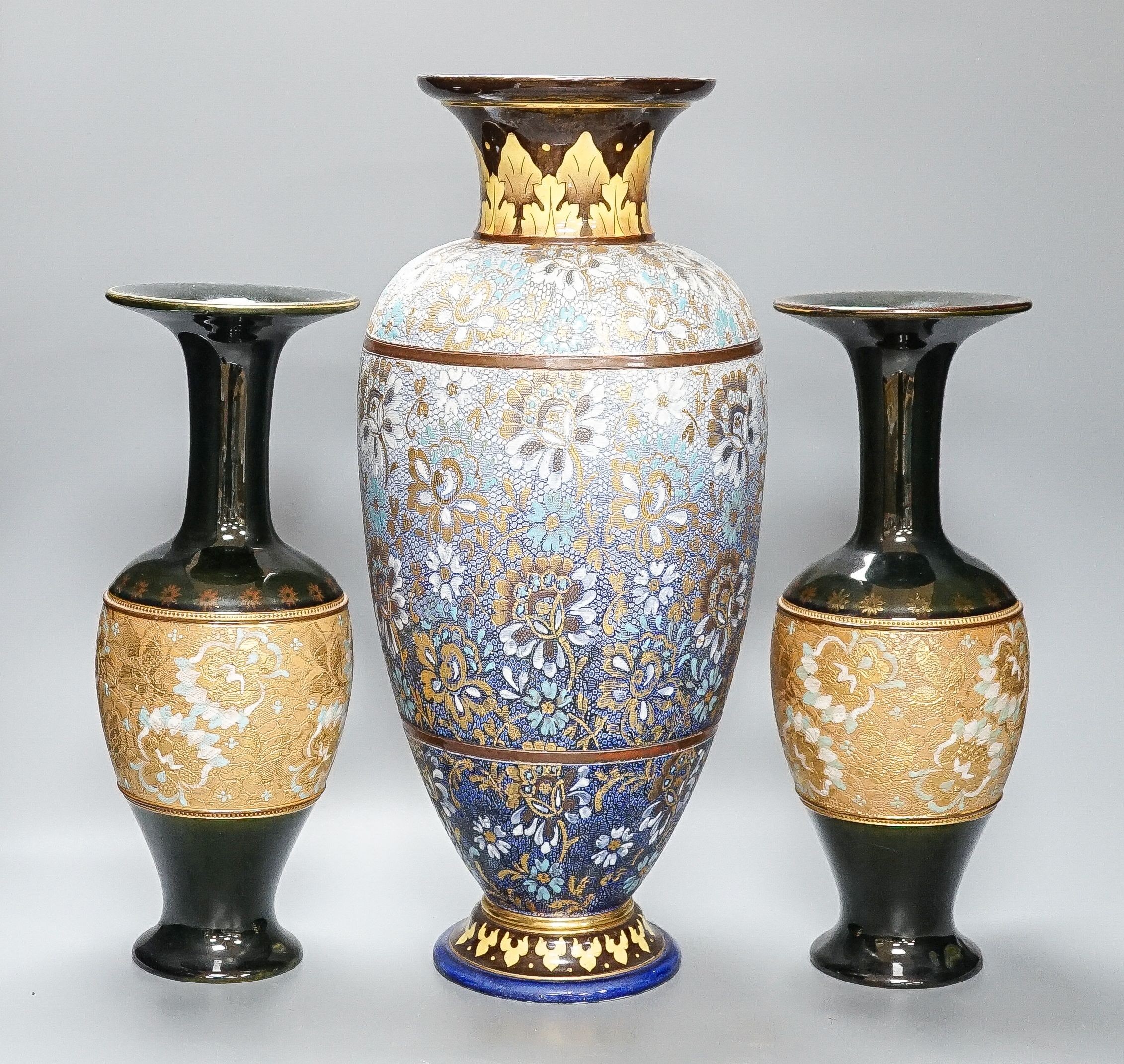 A large Doulton Slater's Patent vase, 46cm and a pair of similar smaller vases, 34cm